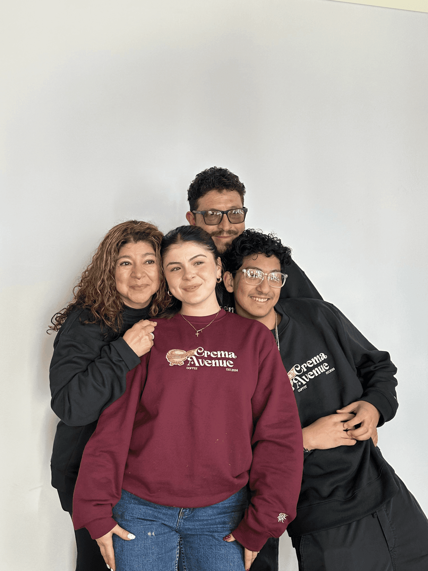 Bri with her family, in Crema Avenue merch